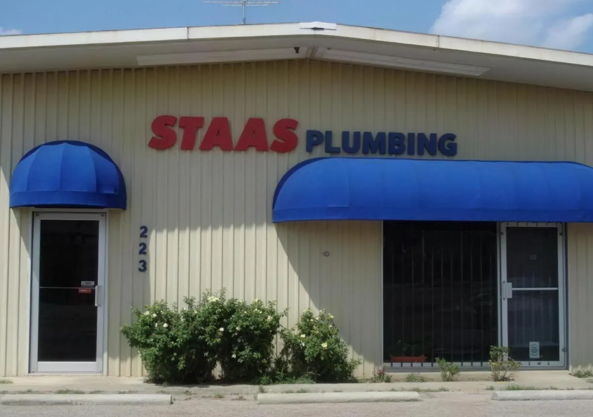 Staas Plumbing storefront with a blue awning