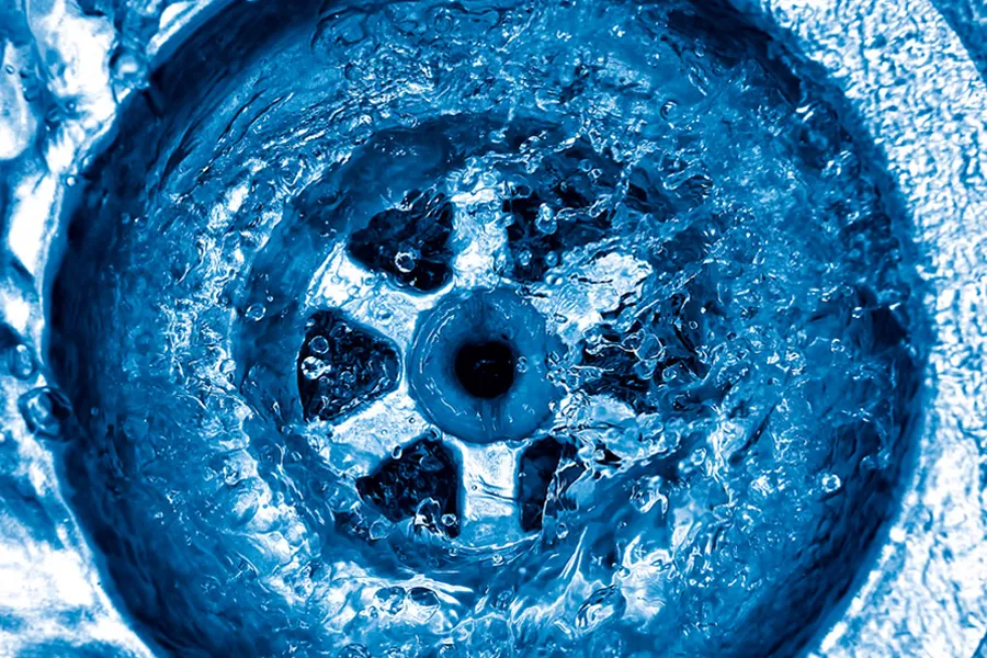 Water swirling down a sink drain